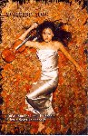 [From cover of I'm a'Doun, Vanessa lying in silver gown on bed of Autumn leaves]