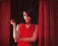 [From Independent 2000-02-14, Vanessa in red dress between curtains, sweet pose]